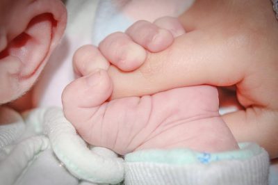 Baby Holding Adult's Finger